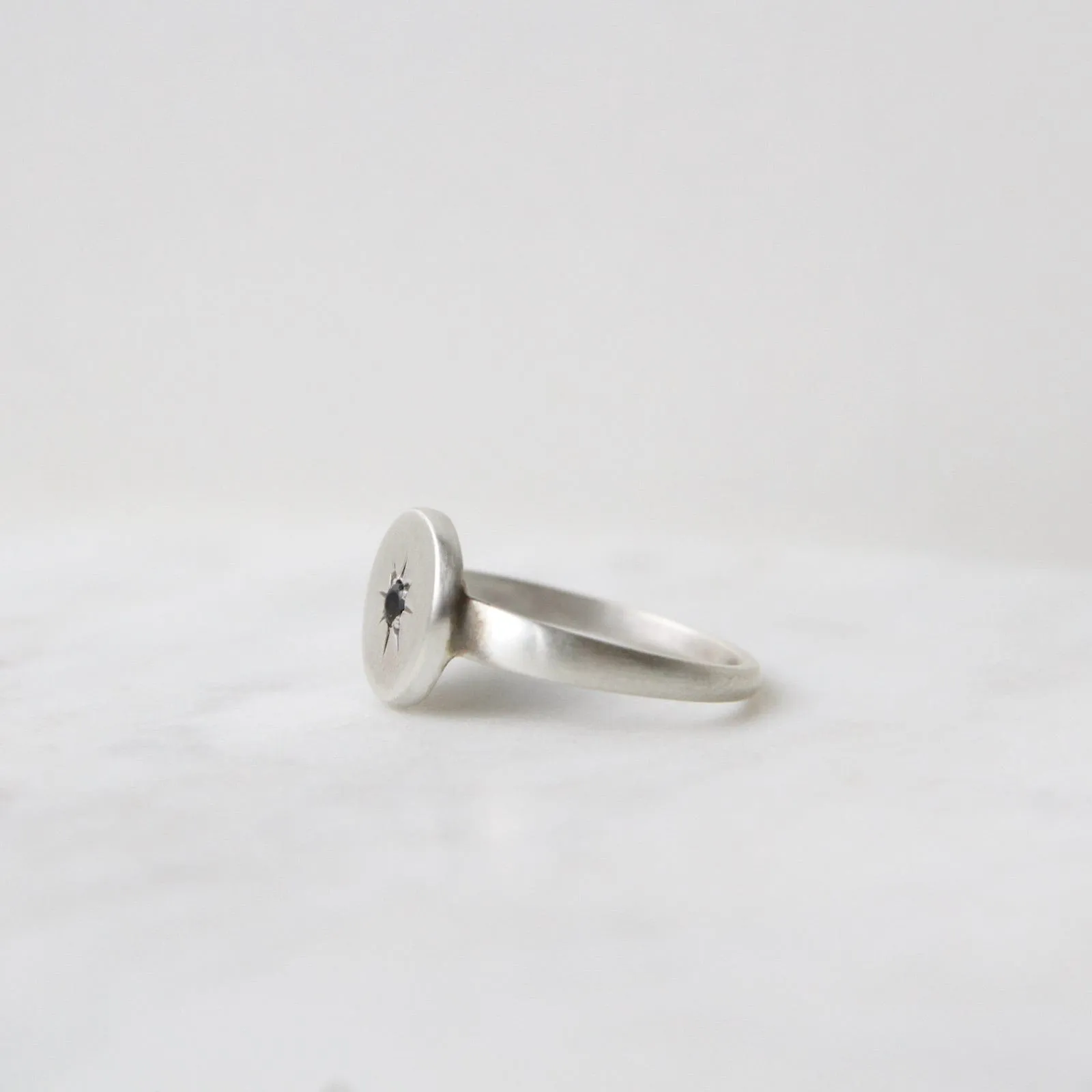 Disc with Star Set Black Onyx Ring
