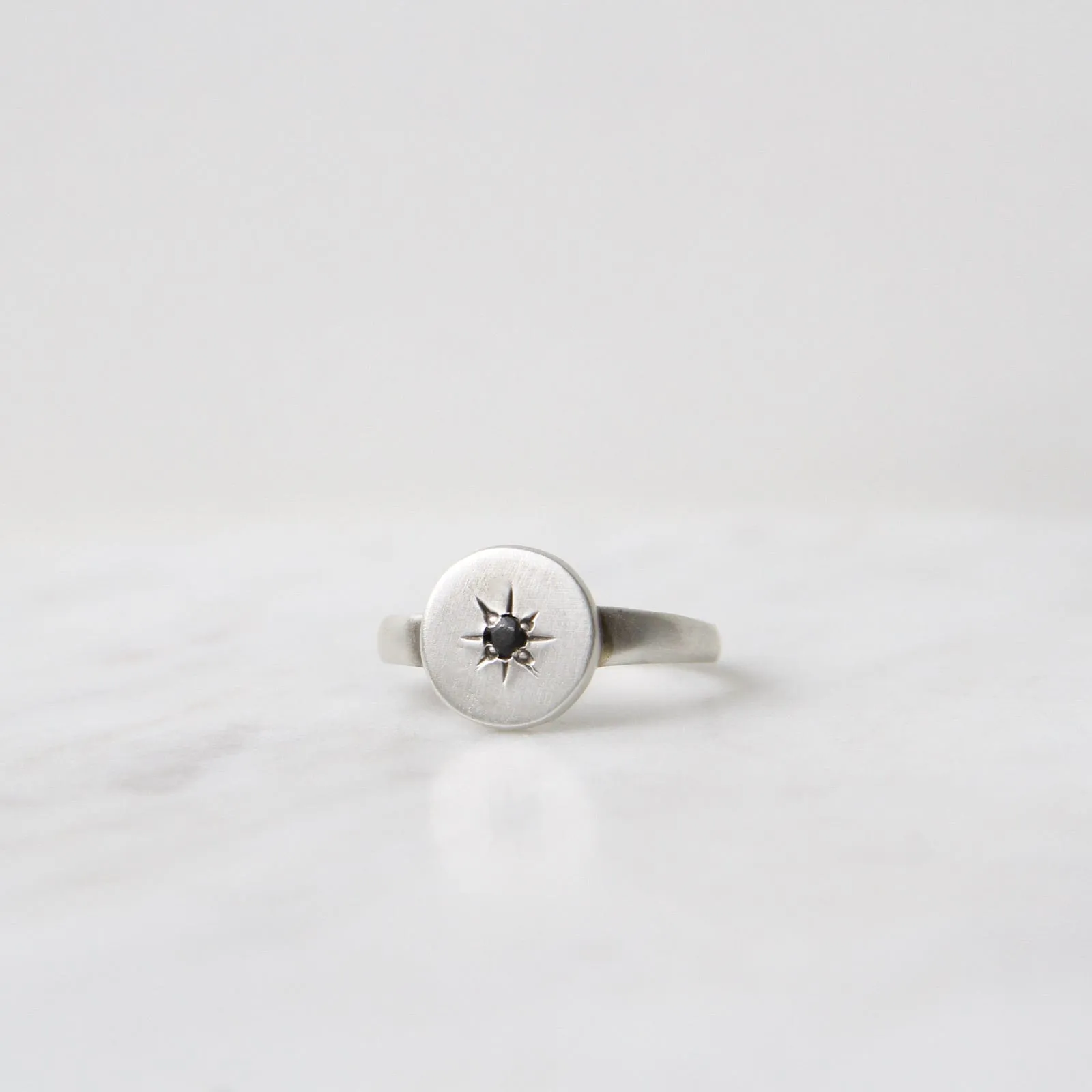 Disc with Star Set Black Onyx Ring